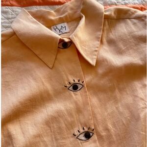 Hannah Kristina Metz eye button blouse